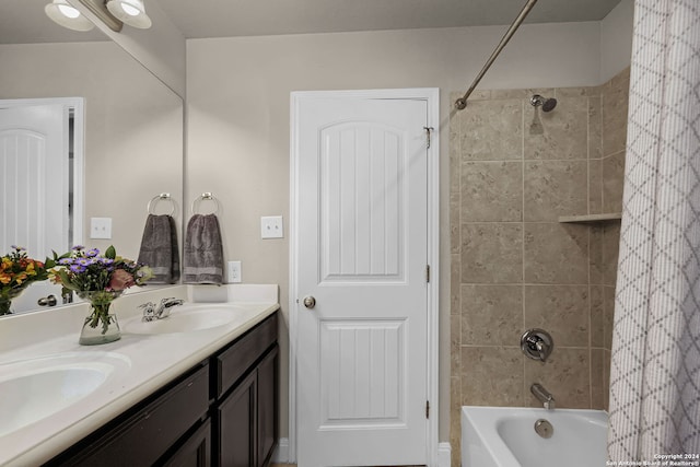 bathroom with vanity and tiled shower / bath