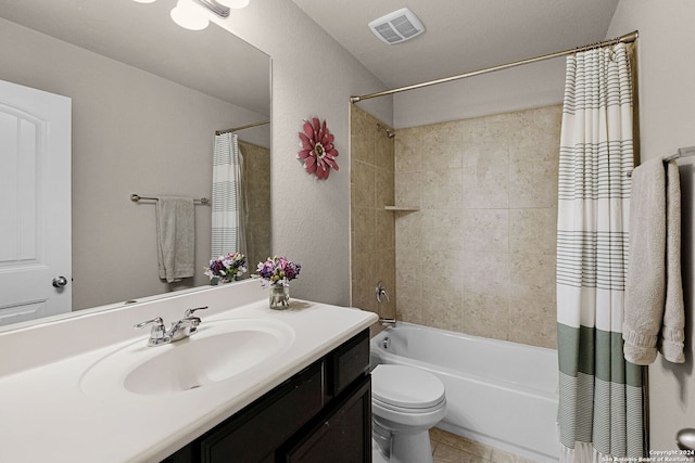 full bathroom with shower / bath combination with curtain, vanity, and toilet