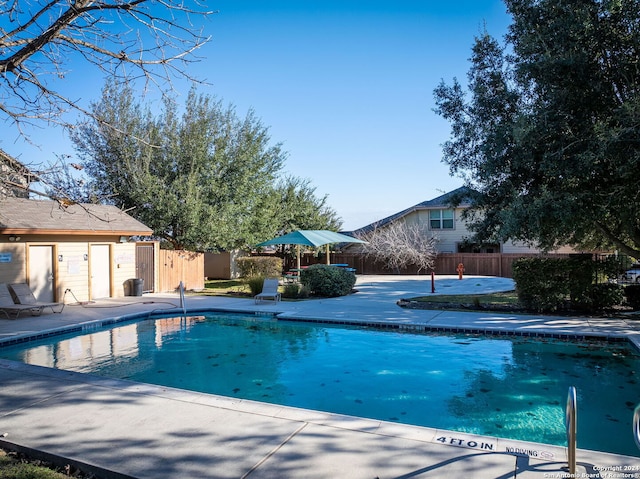 view of pool featuring a patio