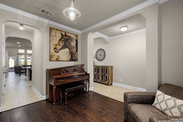 sitting room featuring crown molding, dark hardwood / wood-style flooring, and french doors