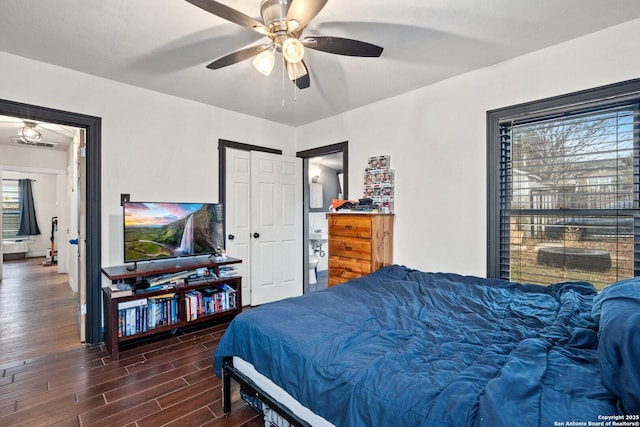 bedroom with multiple windows and ceiling fan