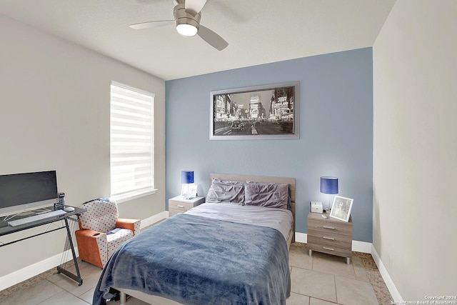 tiled bedroom with multiple windows and ceiling fan