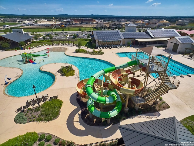 view of pool with a water slide