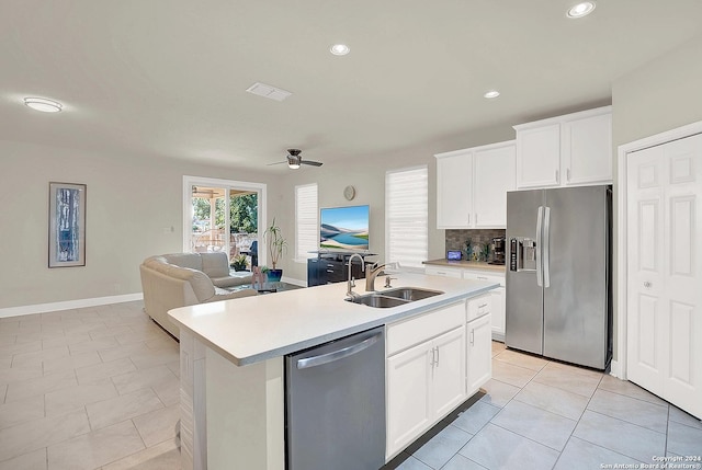 kitchen featuring sink, ceiling fan, an island with sink, white cabinetry, and stainless steel appliances