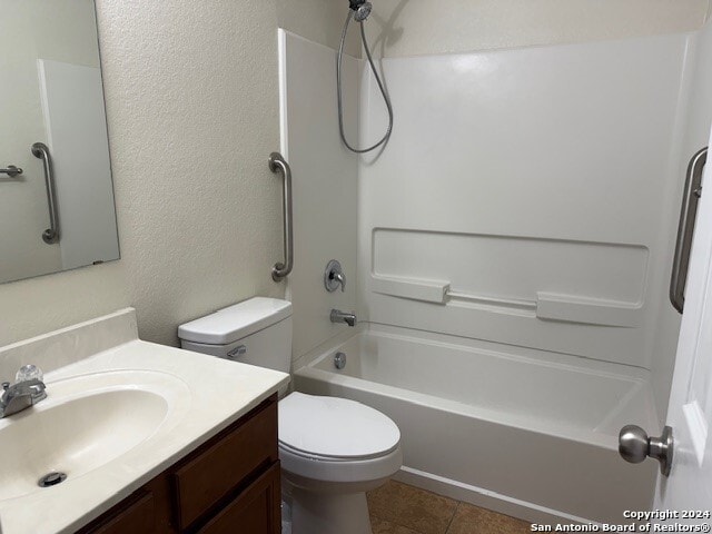 full bathroom featuring tile patterned floors, vanity, shower / bathtub combination, and toilet