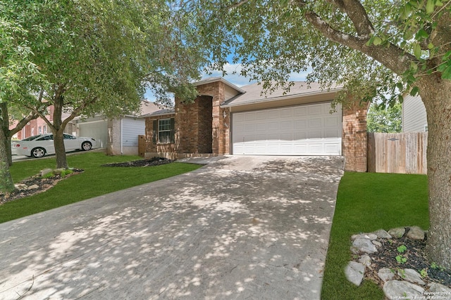 single story home featuring a garage and a front lawn