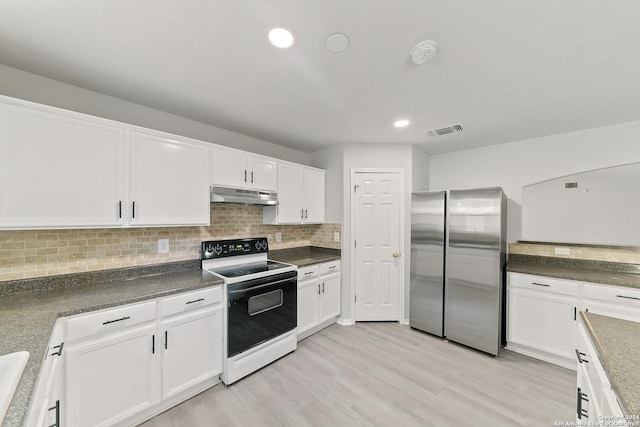 kitchen featuring stainless steel refrigerator, electric stove, white cabinetry, and tasteful backsplash