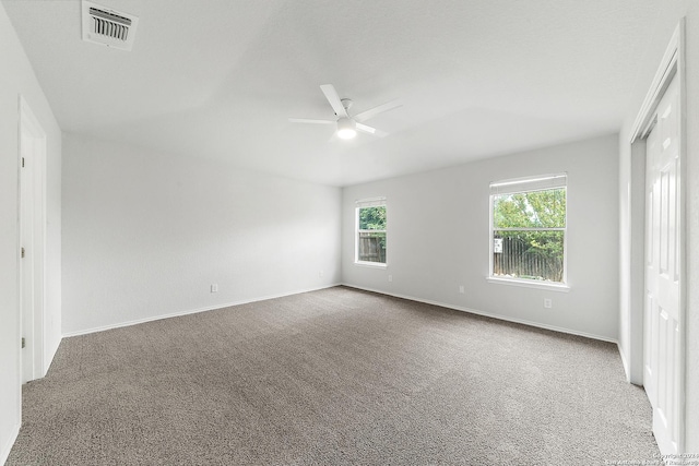 empty room with light carpet and ceiling fan