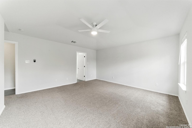 carpeted empty room featuring ceiling fan