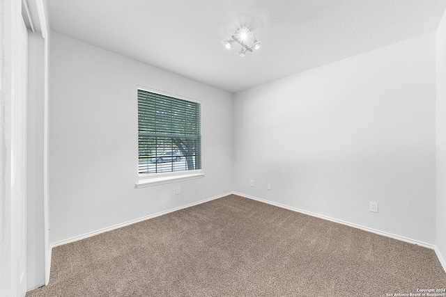 empty room featuring carpet flooring