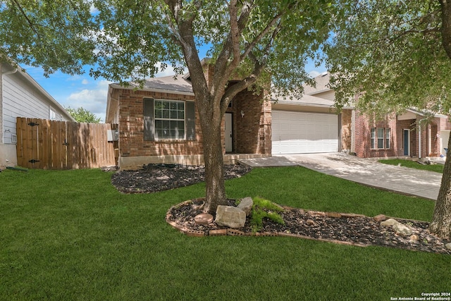 view of front facade with a garage and a front lawn