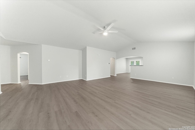 unfurnished living room featuring ceiling fan, lofted ceiling, and light wood-type flooring