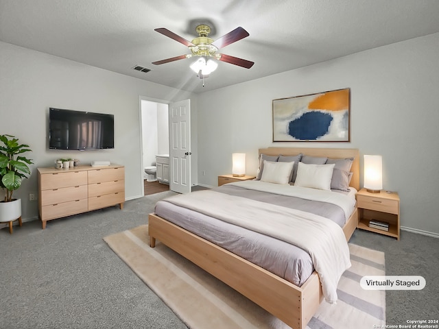 carpeted bedroom featuring ceiling fan and connected bathroom