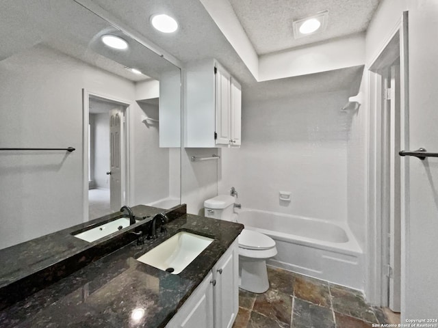 full bathroom featuring vanity, toilet, shower / tub combination, and a textured ceiling