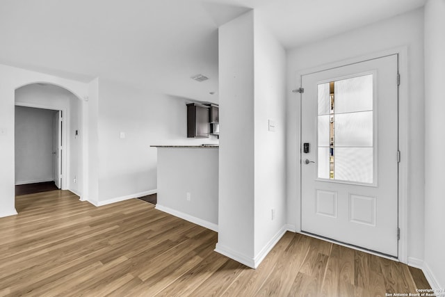 foyer entrance with dark hardwood / wood-style floors