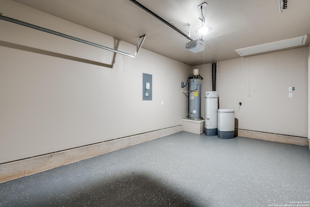 garage featuring electric panel, electric water heater, and a garage door opener