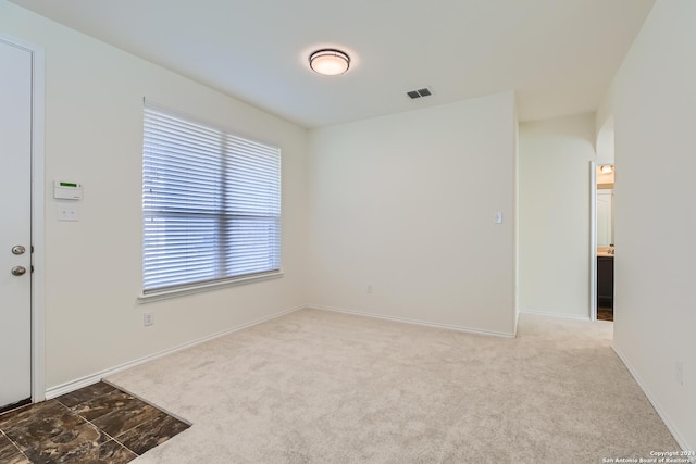 view of carpeted spare room