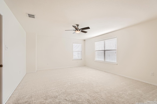 carpeted empty room with ceiling fan