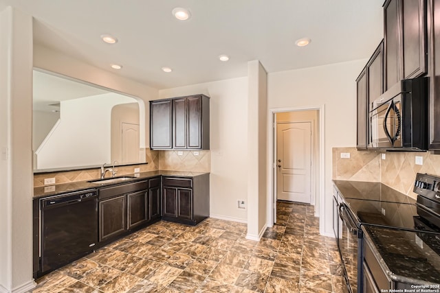 kitchen with decorative backsplash, sink, dark brown cabinetry, and black appliances