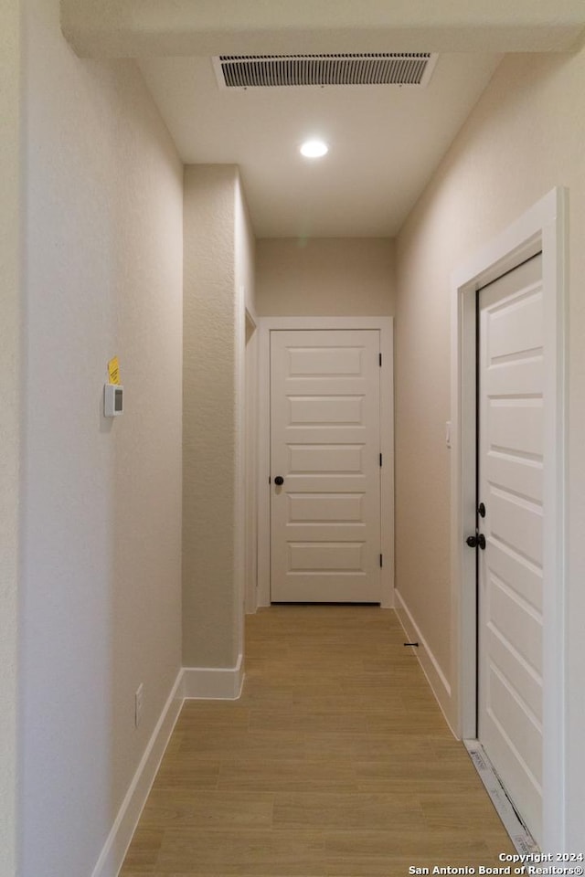 hall featuring light hardwood / wood-style flooring