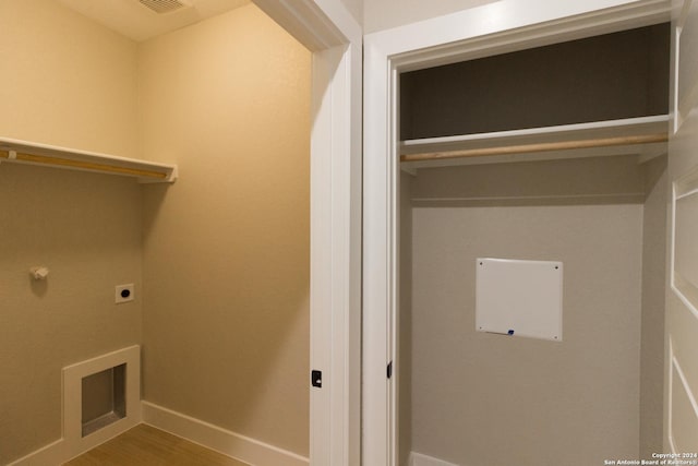 laundry room featuring hookup for an electric dryer and hardwood / wood-style floors