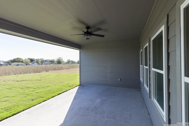 view of patio / terrace featuring ceiling fan and a rural view