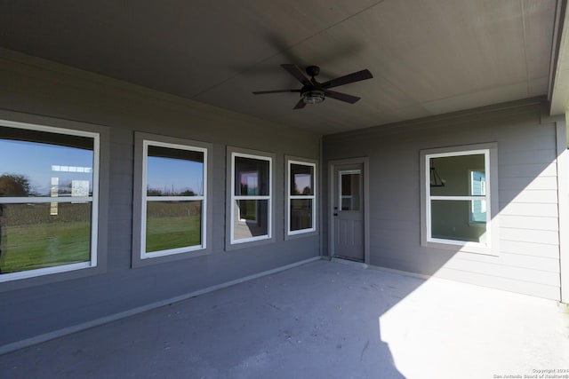 view of patio featuring ceiling fan