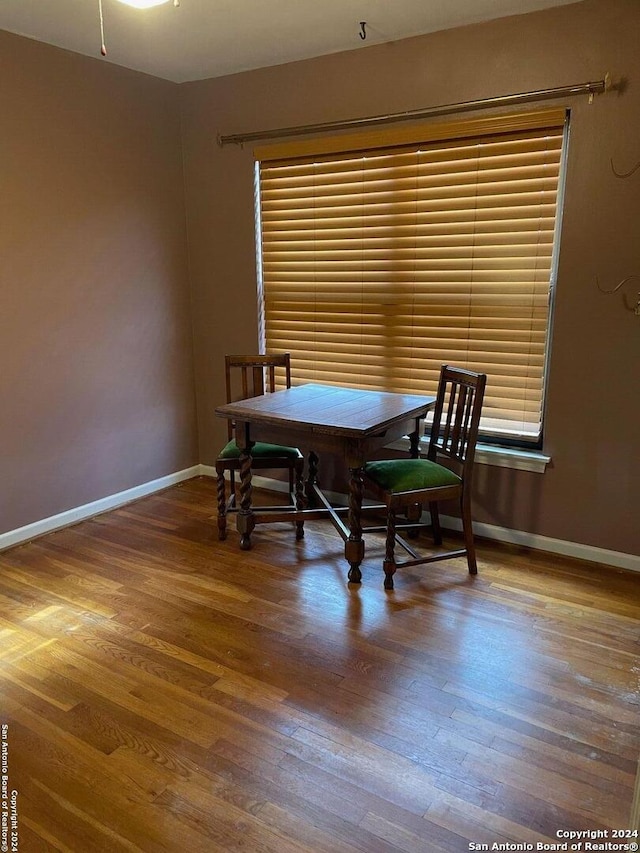 dining room with hardwood / wood-style floors