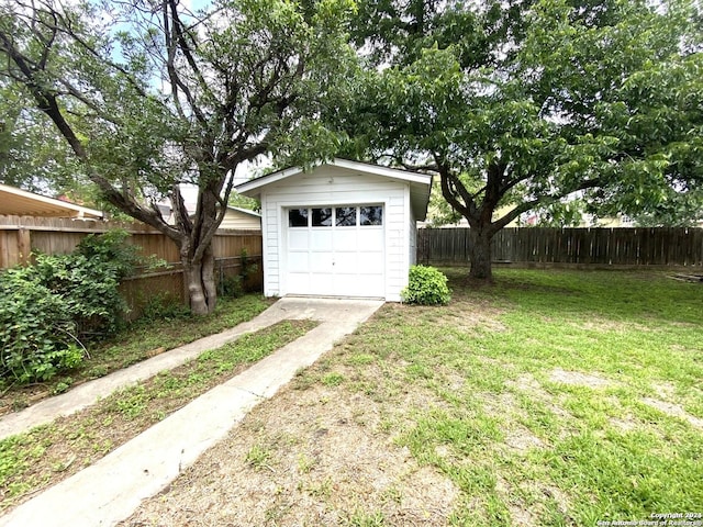 garage featuring a yard