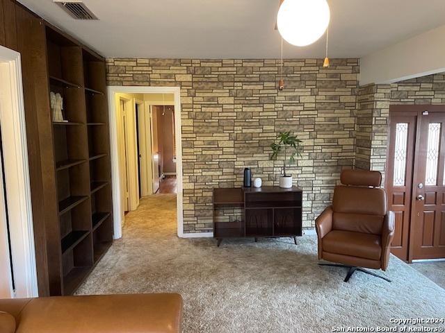 living area featuring light colored carpet