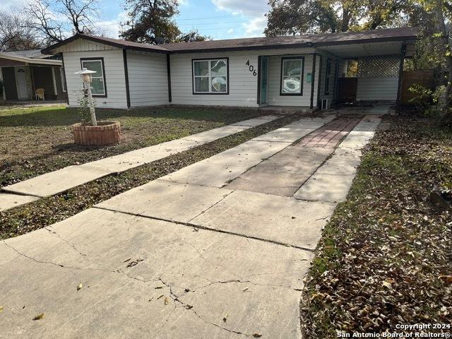 ranch-style home with a carport