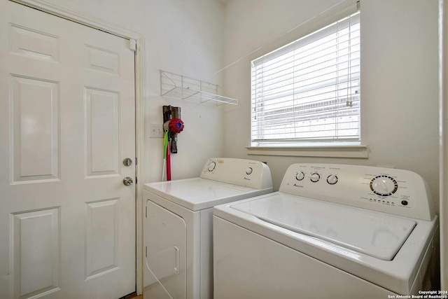 clothes washing area featuring washing machine and clothes dryer