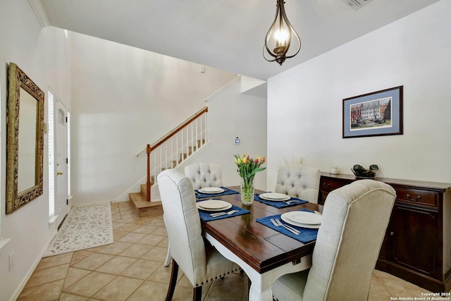 tiled dining space with crown molding