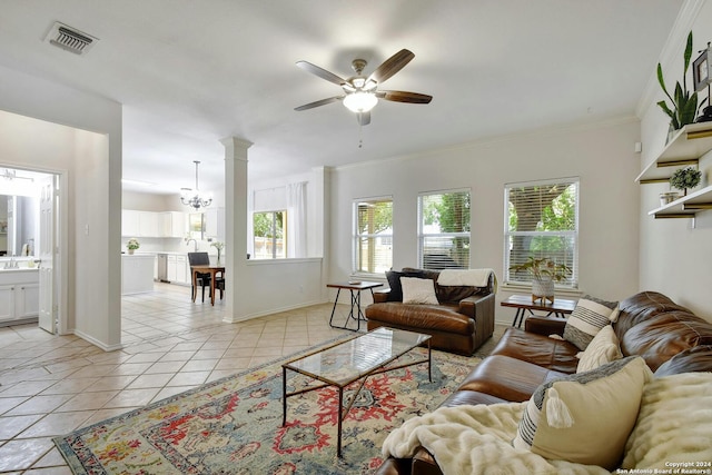 tiled living room featuring ceiling fan with notable chandelier and crown molding