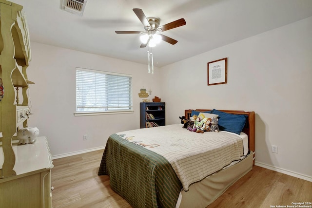 bedroom featuring light wood-type flooring and ceiling fan