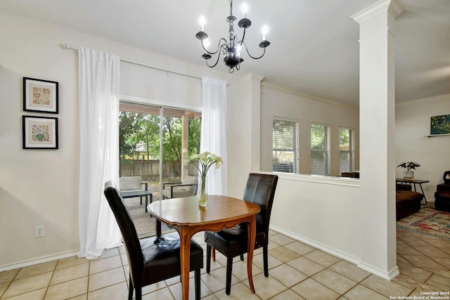 dining room with light tile patterned floors, crown molding, and a chandelier