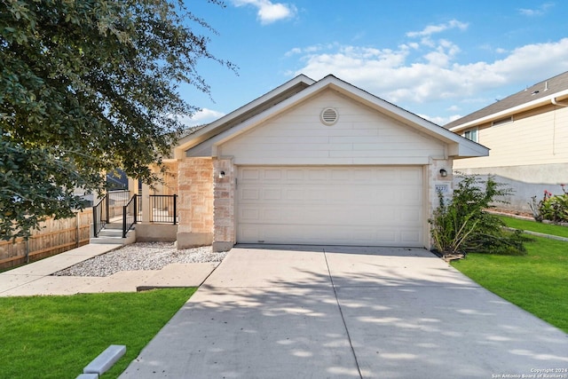 ranch-style home featuring a garage