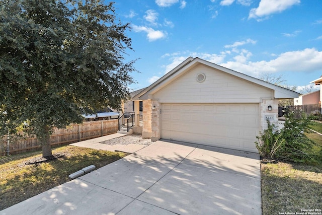 ranch-style home with a garage