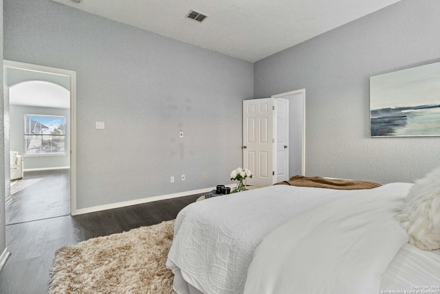 bedroom featuring dark hardwood / wood-style flooring