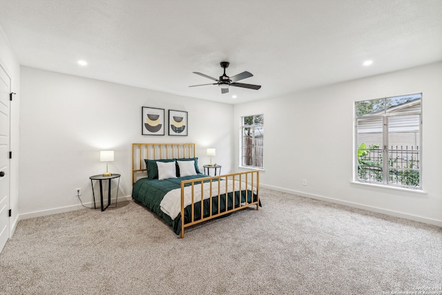 bedroom with ceiling fan and carpet floors