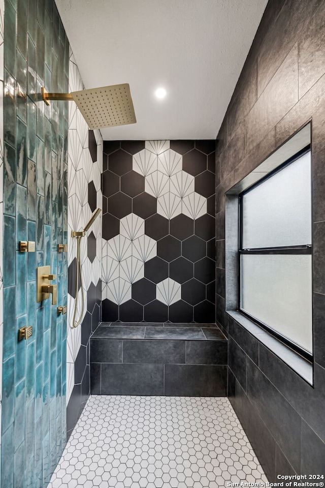 bathroom with tile walls and walk in shower