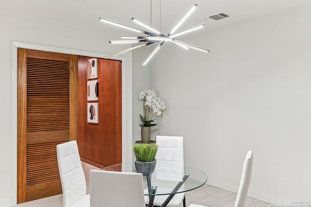 dining area featuring an inviting chandelier