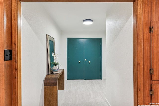 hallway with light hardwood / wood-style flooring