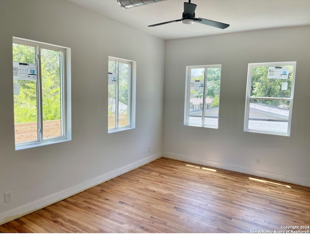 unfurnished room featuring ceiling fan and light hardwood / wood-style floors