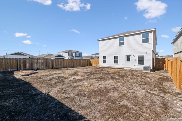 rear view of house with central AC