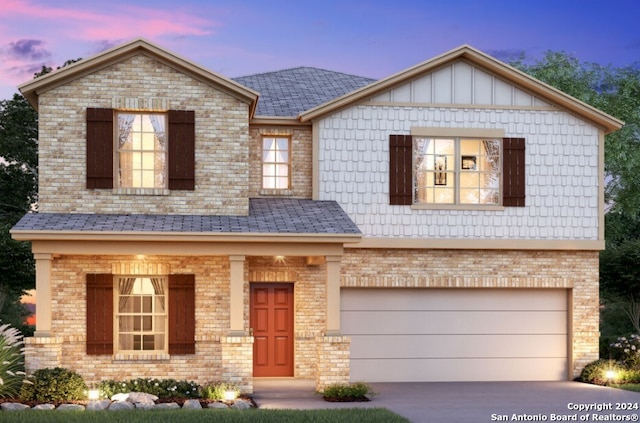 view of front of property featuring brick siding, board and batten siding, concrete driveway, and an attached garage