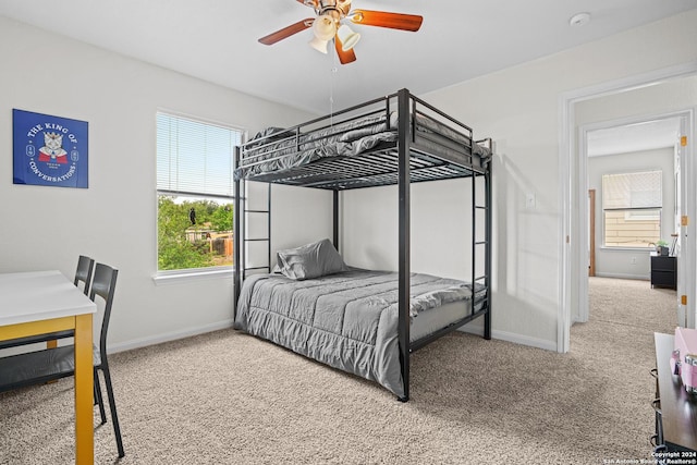 bedroom featuring ceiling fan and carpet floors