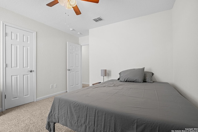 carpeted bedroom featuring ceiling fan