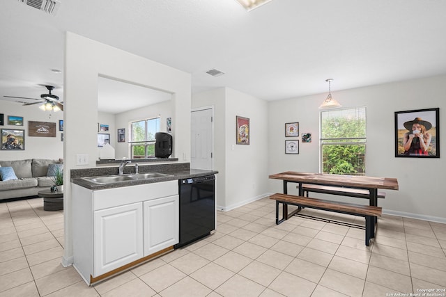 kitchen featuring dishwasher, sink, hanging light fixtures, ceiling fan, and white cabinetry