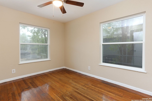 spare room with ceiling fan and hardwood / wood-style floors